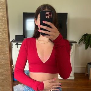 Red, long sleeve cropped top.